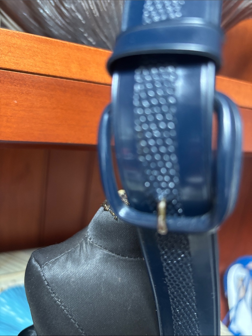 Navy blue belt features a distinctive textured center stripe